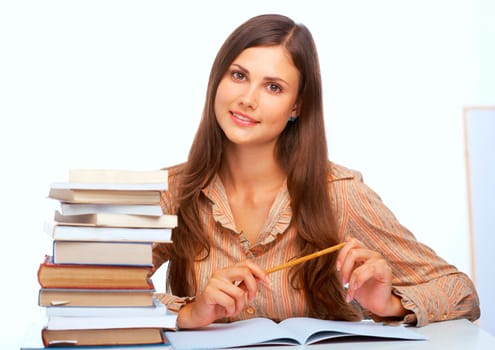 Young female student smiling against light blue background