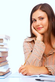 Close-up of teenage girl smiling against light blue background