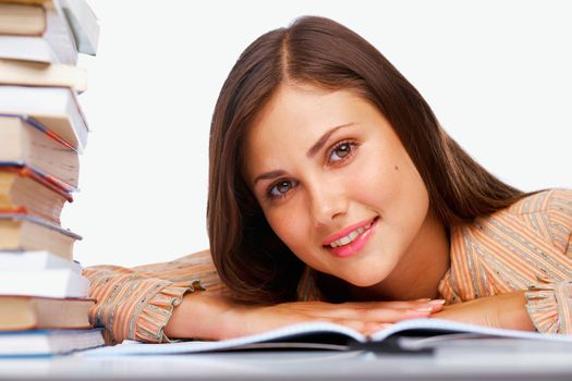 Close-up of a smiling female student with a books