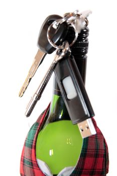 bottle dressed in jacket warmer with keys hanging on alcohol bottle on white background depicting drunk driving and addictions can kill