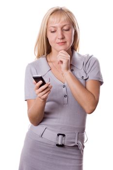 Blonde woman thinking with cell phone in her hand. Isolated on white. #1