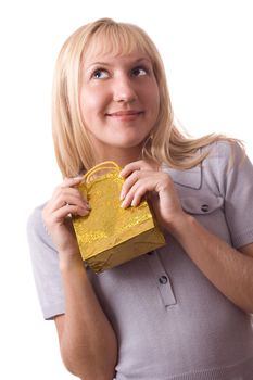 Blonde woman standing with small gift pack, surprised. Isolated on white. #1