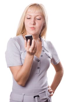 Blonde woman thinking with cell phone in her hand. Isolated on white. #3