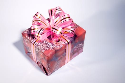 Beautiful gift box with a bow on a white background