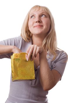 Blonde woman standing with small  gift pack, surprised. Isolated on white. #2
