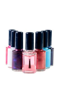 Small bottles with a varnish for manicure on a white background.