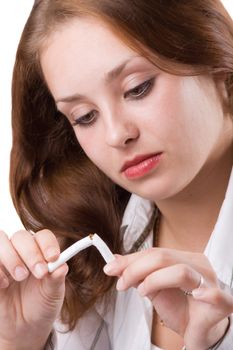 Portrait of beautiful girl breaking cigarette. Isolated against white background. #1