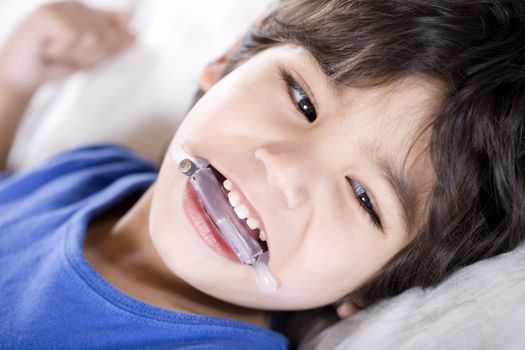 Disabled boy wearing a mouth guard to prevent biting