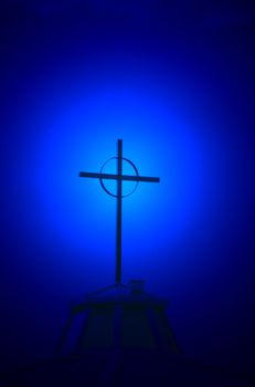 Blue halo effect behind church steeple and cross