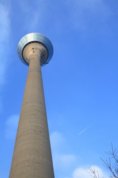 Radio tower in Dusseldord, Germany on blue sky background