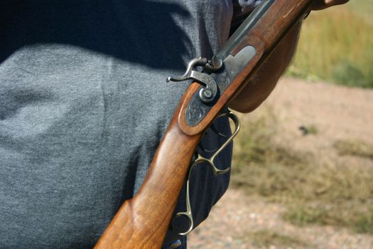 Detail of trigger of a black powder rifle.