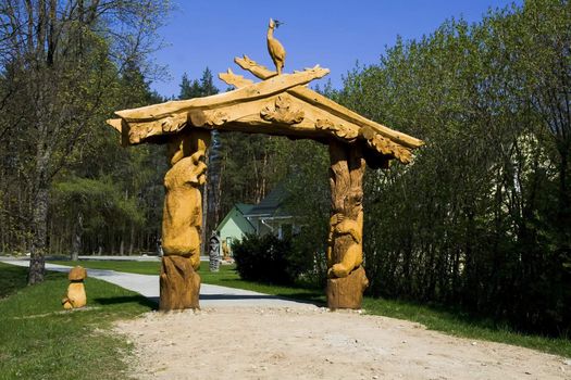 A wooden sculpture at the end of the path in the park