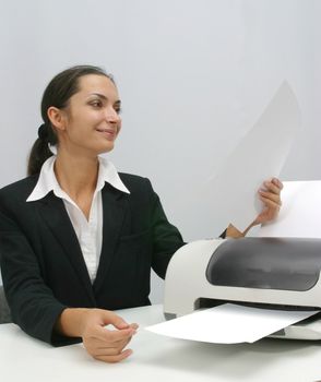 Business woman is prinring in office, copy, duplicate, calling