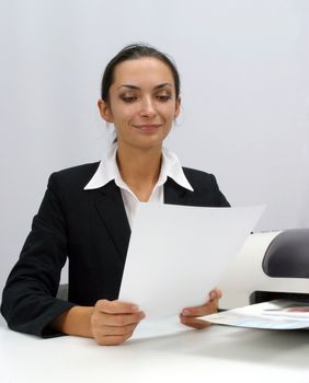 Business woman is printing in office, copy, duplicate, calling