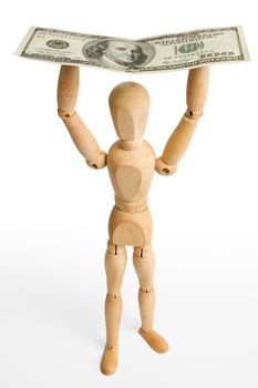 The wooden figure holds dollars.Isolated on white [with clipping path].