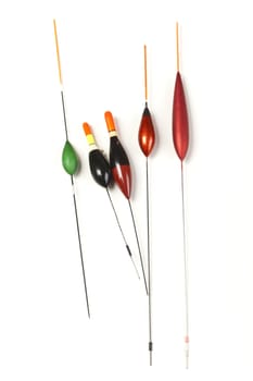 Image of fishing bobbers on reflective surface