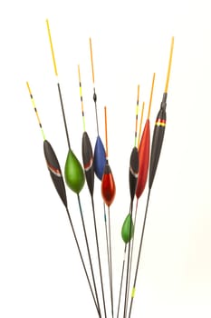 Image of fishing bobbers on reflective surface