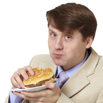 The young businessman is the dinner isolated on a white background