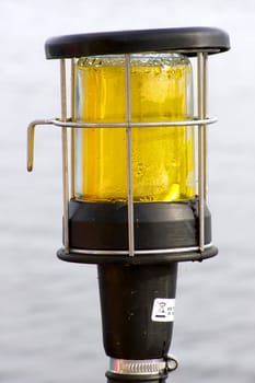 misted over yacht yellow color lantern  overwater