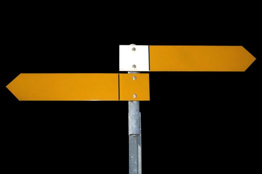 Two yellow pointers on a signpost, pointing directly to right and left, isolated on a black background. Clipping path included.