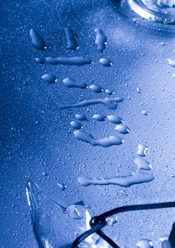 Macro of droplets of water on a bright blue background