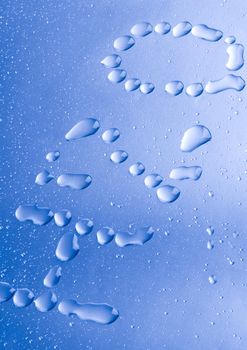 Macro of droplets of water on a bright blue background