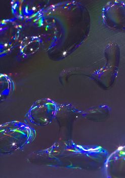 Macro of droplets of water on a bright blue background