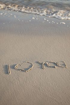 Text written on beach