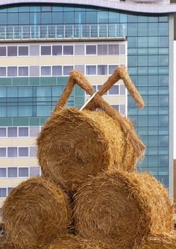 bundle of hay against the modern building background