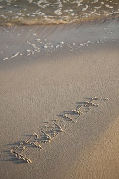 Text written on beach