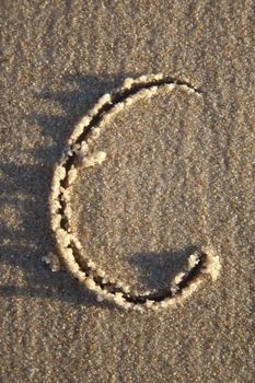 Letter written on wet sand