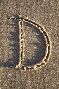 Letter written on wet sand