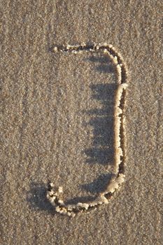 Letter on wet sand