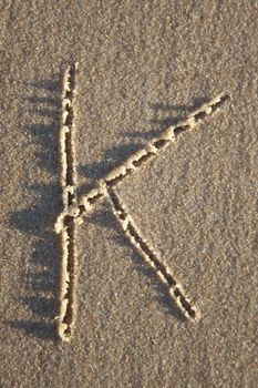 Letter on wet sand