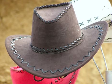 cowboy's hat against the sand background       