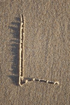 Letter on wet sand