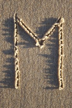 Letter on wet sand