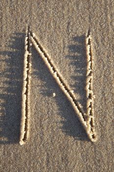 Letter on wet sand