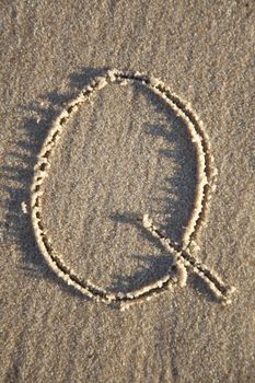 Letter on wet sand