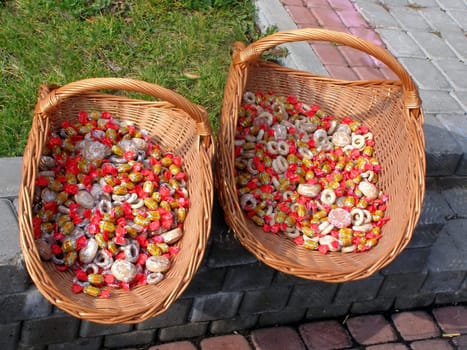two baskets with candy and honey cakes at the street