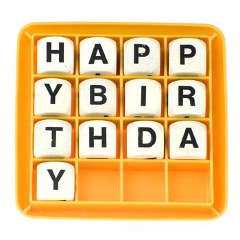 a lot of old dices with letters spell out "happy birthday"