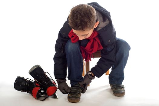 a young boy is going ice-skating