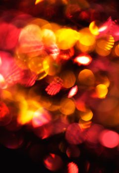 Defocus of red and yellow lights. Image is blurry and grainy.