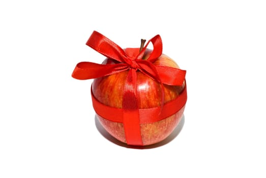 red apple with a gift bow on a white background