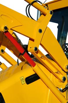 Hydraulic elements of the universal bulldozer of yellow color on a white background, Isolated (look similar images in my portfolio)
