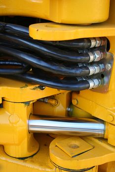 Hydraulic elements of the heavy building bulldozer of yellow color, (look similar images in my portfolio)