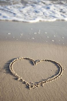 Heart painted on wet sand