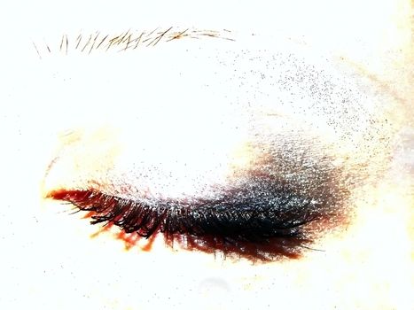 closed woman eye with eye shadow  