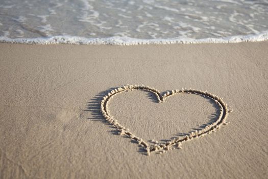 Heart painted on wet sand