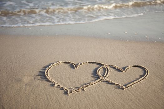 Hearts painted on wet sand